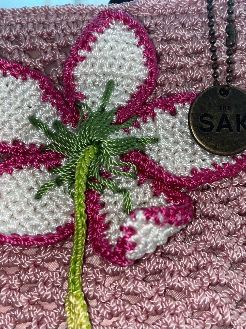 The SAK Pink Crochet Tote Bag with Brown Wooden Handles and Flower Appliqué - Picture 4 of 7